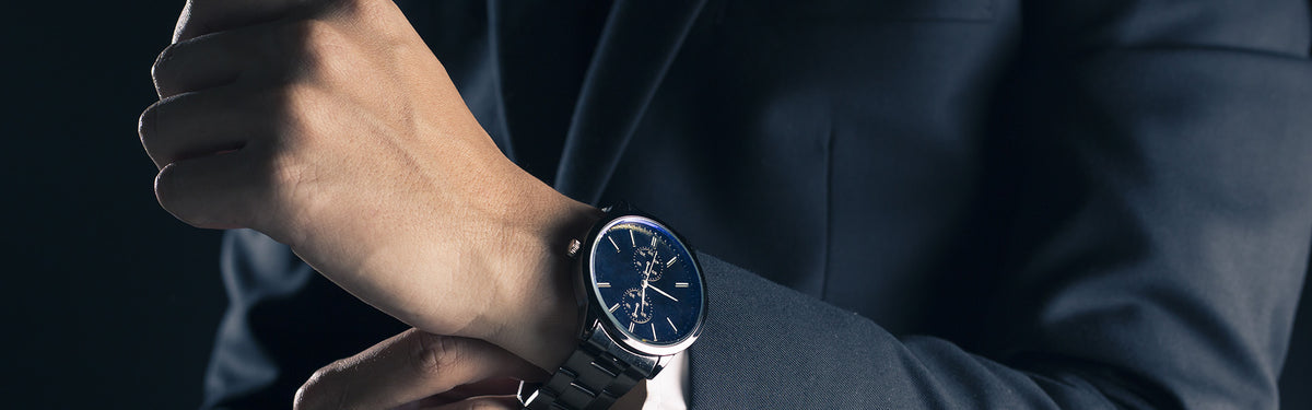 Banner image of a mans watch